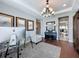 Bright living room features modern decor, wood floors, neutral rug, and a glimpse into other rooms at 16150 Parkwyn St, Winter Garden, FL 34787