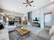 Bright and airy living room with tile flooring, a ceiling fan, and neutral colors at 16150 Parkwyn St, Winter Garden, FL 34787