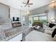 Comfortable living room with ample seating, natural light, and access to the backyard at 16150 Parkwyn St, Winter Garden, FL 34787