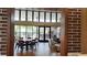 Clubhouse lounge area featuring a table, chairs and view of pool at 16150 Parkwyn St, Winter Garden, FL 34787