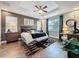 Tranquil main bedroom with tray ceiling, hardwood floors, and stylish decor at 16150 Parkwyn St, Winter Garden, FL 34787