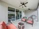 Covered patio boasts multiple ceiling fans, comfortable seating and outdoor cooking station at 16150 Parkwyn St, Winter Garden, FL 34787