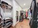 Spacious walk-in closet with metal shelving and wood floor provides ample storage at 16150 Parkwyn St, Winter Garden, FL 34787