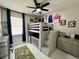 This bedroom features a bunk bed with a ceiling fan and window with natural light at 168 Bradwick Cir, Debary, FL 32713