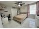 Well-lit bedroom with a comfortable bed, modern desk, and stylish decor at 168 Bradwick Cir, Debary, FL 32713