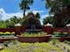 Elegant brick entrance sign for Saxon Woods community with manicured landscaping at 168 Bradwick Cir, Debary, FL 32713