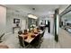 Elegant dining room with stylish decor, modern chandelier, and a view of the kitchen at 168 Bradwick Cir, Debary, FL 32713