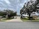 Inviting single-story home with mature trees, a three-car garage and lush landscaping at 168 Bradwick Cir, Debary, FL 32713