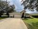 Charming single-story home with a three car garage and well-manicured lawn at 168 Bradwick Cir, Debary, FL 32713