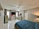 Comfortable main bedroom featuring a ceiling fan, TV, and modern tile flooring at 168 Bradwick Cir, Debary, FL 32713