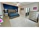 Bright main bedroom features elegant furnishings, a decorative accent wall, and modern tile flooring at 168 Bradwick Cir, Debary, FL 32713