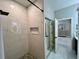 Close up of modern shower with marble tiling, and black hardware, next to the bathroom entrance at 168 Bradwick Cir, Debary, FL 32713