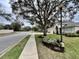 Pleasant street view with a landscaped yard and a well-maintained single story home at 168 Bradwick Cir, Debary, FL 32713
