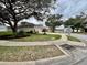 Quiet neighborhood street with mature trees and a sidewalk leading to landscaped yards at 168 Bradwick Cir, Debary, FL 32713