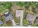 Aerial view of a residential home showcasing the roof, landscaping, and surrounding trees at 19331 Briercrest Trl, Orlando, FL 32833