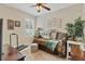 Bedroom offering a ceiling fan, a daybed with an assortment of throw pillows, and ample natural light at 19331 Briercrest Trl, Orlando, FL 32833
