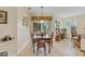 Bright breakfast nook features a wooden table set, charming decor and sliding glass doors leading to the outdoors at 19331 Briercrest Trl, Orlando, FL 32833