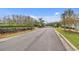 Entrance to a gated community featuring well-maintained landscaping at 19331 Briercrest Trl, Orlando, FL 32833