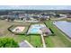 Aerial view of a community pool, playground, and lake in a residential area at 19331 Briercrest Trl, Orlando, FL 32833