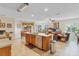 Open-concept kitchen with large island, stainless steel appliances and open to the living area at 19331 Briercrest Trl, Orlando, FL 32833