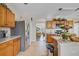Spacious kitchen featuring stainless steel appliances, wooden cabinetry and open layout at 19331 Briercrest Trl, Orlando, FL 32833