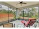 The screened lanai features comfortable seating and views of the surrounding backyard at 19331 Briercrest Trl, Orlando, FL 32833