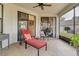 The screened lanai features comfortable seating and views of the surrounding yard at 19331 Briercrest Trl, Orlando, FL 32833