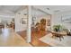Open concept living area showcases tile floors flowing seamlessly into hardwood dining area at 19331 Briercrest Trl, Orlando, FL 32833