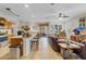 Open-concept living room with large windows and connecting to the kitchen and dining areas at 19331 Briercrest Trl, Orlando, FL 32833