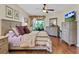 Comfortable main bedroom with hardwood flooring, ceiling fan, and plenty of natural light at 19331 Briercrest Trl, Orlando, FL 32833