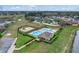 Aerial view of the community pool and playground, with lush landscaping and ample parking spaces at 19331 Briercrest Trl, Orlando, FL 32833