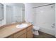 Clean bathroom featuring a vanity with sink, toilet, and bathtub with shower at 1990 Erving Cir # 207, Ocoee, FL 34761