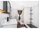 Bathroom featuring tiled shower, quartz counters, and modern fixtures at 2286 Sunny St, Kissimmee, FL 34741