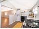Kitchen featuring modern appliances and open access to living room at 2286 Sunny St, Kissimmee, FL 34741