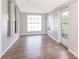 Bright living room featuring sleek wood floors, white trim, and abundant natural light at 2286 Sunny St, Kissimmee, FL 34741