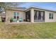 Backyard with a brick patio and screened-in porch at 2711 Wadeview Loop, St Cloud, FL 34769