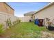 Backyard featuring a well-maintained lawn and a secure privacy fence at 2711 Wadeview Loop, St Cloud, FL 34769