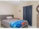 Comfortable bedroom with a cozy bed, simple decor, and soft lighting at 2711 Wadeview Loop, St Cloud, FL 34769