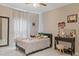 Bright bedroom featuring a cozy bed, desk area, and soft natural light at 2711 Wadeview Loop, St Cloud, FL 34769