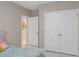 Neutral bedroom featuring a closet with bi-fold doors at 2711 Wadeview Loop, St Cloud, FL 34769