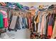 Walk-in closet with ample storage space for clothes, shoes, and accessories at 2711 Wadeview Loop, St Cloud, FL 34769