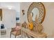 Stylish foyer with a decorative mirror, elegant console table, and unique décor at 2711 Wadeview Loop, St Cloud, FL 34769