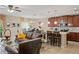 Spacious open-concept living room and kitchen area filled with natural light and elegant décor at 2711 Wadeview Loop, St Cloud, FL 34769