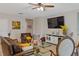 Comfortable living room featuring leather seating, modern décor, and a bright, airy ambiance at 2711 Wadeview Loop, St Cloud, FL 34769