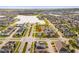 Aerial view of a lakeside community with a red marker on a charming two-story home at 2800 Cello Ln, Kissimmee, FL 34741