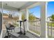 Relaxing balcony area with exercise equipment and a view of the street at 2800 Cello Ln, Kissimmee, FL 34741