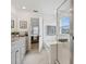 Bathroom with a bathtub, glass-enclosed shower, and bright lighting at 2800 Cello Ln, Kissimmee, FL 34741