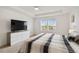 Bedroom showcasing a large window offering natural light and a comfortable bed at 2800 Cello Ln, Kissimmee, FL 34741