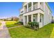 Inviting exterior with a covered porch and lush landscaping at 2800 Cello Ln, Kissimmee, FL 34741