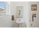 Stylish half bathroom with modern fixtures and decor at 2800 Cello Ln, Kissimmee, FL 34741